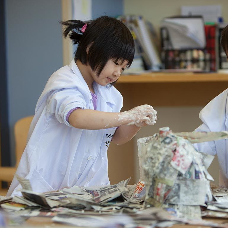 Bright Horizons kindergarten Prep Student with paper mache 