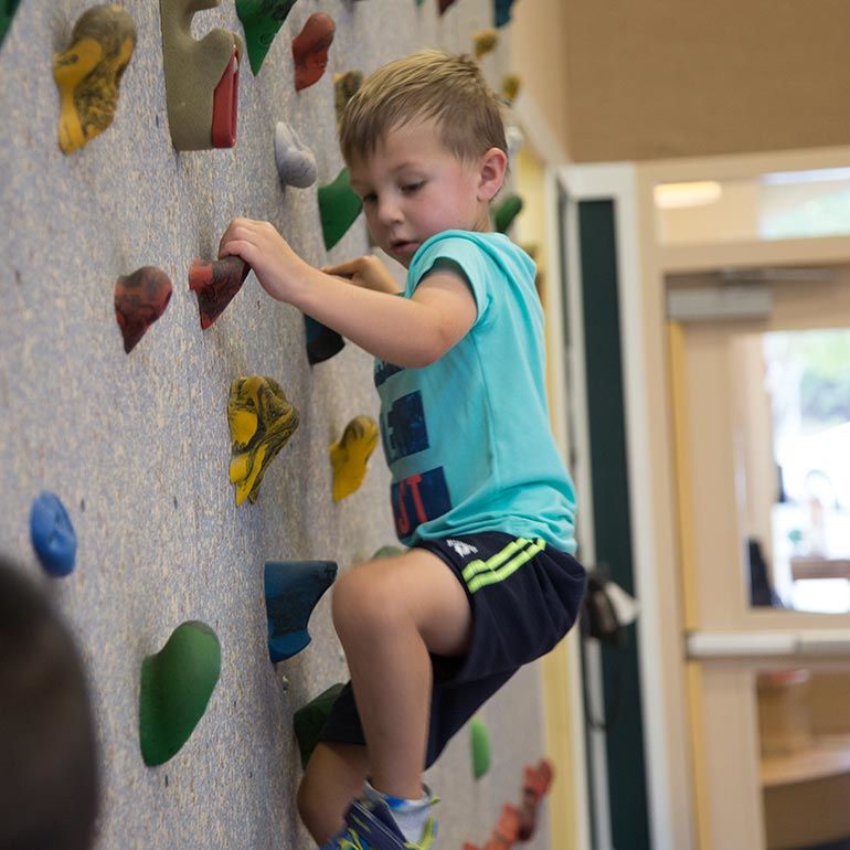 Bright Horizons kindergarten Prep Student rock climbing