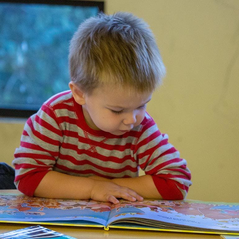 Bright Horizons Toddler Student reading a book