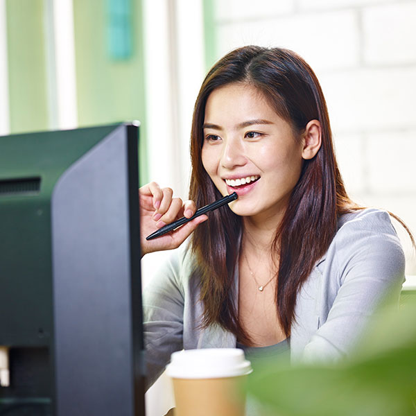 Young woman looking at a computer monitor