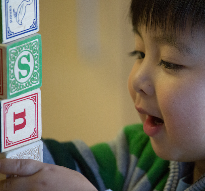 Preschool boy playing with blocks