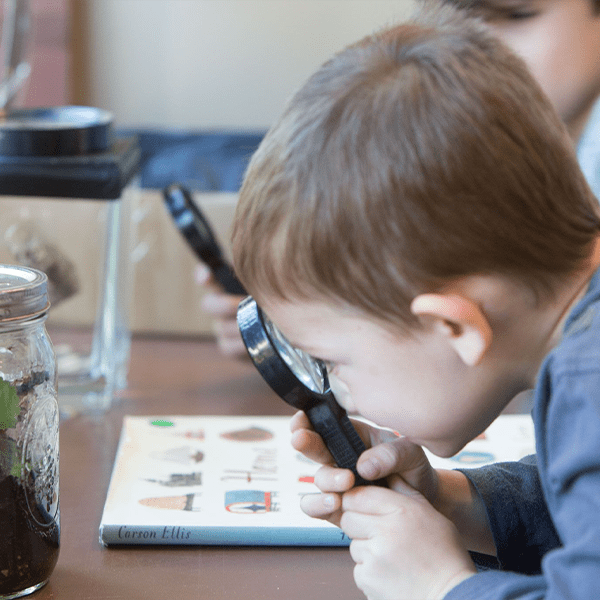 Boy with a magnifying glass